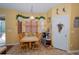 This eat-in kitchen includes a large table and access to the pantry and screened lanai at 7653 Stoney Hill Dr, Wesley Chapel, FL 33545