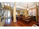 Open floorplan with hardwood floors featuring a living room, dining room and grand staircase at 7653 Stoney Hill Dr, Wesley Chapel, FL 33545
