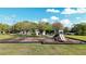 A playground with swings, slides and other playground equipment on wood chips at 7653 Stoney Hill Dr, Wesley Chapel, FL 33545