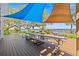 Community deck with picnic tables and shade sails, and lake view at 90 S Highland Ave # 1317, Tarpon Springs, FL 34689