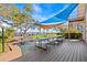 Community deck with picnic tables and shade sails, with lake view at 90 S Highland Ave # 1317, Tarpon Springs, FL 34689