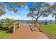 Community dock access with seating, boat slips, and lake view at 90 S Highland Ave # 1317, Tarpon Springs, FL 34689