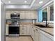 Nicely updated kitchen with stainless appliances, modern sink and countertops at 90 S Highland Ave # 1317, Tarpon Springs, FL 34689