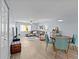 Spacious living room and dining area with modern decor, plush seating, and plenty of natural light at 90 S Highland Ave # 1317, Tarpon Springs, FL 34689