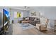 Inviting living room featuring a comfortable sectional, stylish decor, and large windows for natural light at 90 S Highland Ave # 1317, Tarpon Springs, FL 34689
