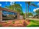 Community entrance sign with the name Timber Greens with landscaping at 9426 Green Needle Dr, New Port Richey, FL 34655