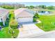 Charming home with a well-manicured lawn and a two-car garage, located next to a pond at 9426 Green Needle Dr, New Port Richey, FL 34655
