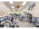 Well-equipped gym featuring modern exercise machines, ceiling fans, and a wall-mounted television at 9426 Green Needle Dr, New Port Richey, FL 34655
