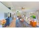Bright living room with vaulted ceilings, hardwood floors, and lots of natural light at 9426 Green Needle Dr, New Port Richey, FL 34655