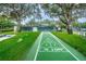 Brightly painted shuffleboard court with clear markings on a sunny day at 9426 Green Needle Dr, New Port Richey, FL 34655