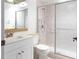 Bathroom featuring shower with glass doors, a neutral vanity, and sink basin at 1012 Pearce Dr # 105, Clearwater, FL 33764