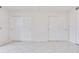 Bedroom featuring tile floors and closet with sliding doors, providing ample storage space at 1012 Pearce Dr # 105, Clearwater, FL 33764