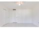 A bedroom featuring neutral tile floors and double closet at 1012 Pearce Dr # 105, Clearwater, FL 33764