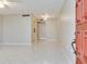 Neutral living room with tile floor, light walls, and a clear view into other rooms at 1012 Pearce Dr # 105, Clearwater, FL 33764