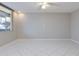 Neutral living room with tile floor, light walls, and window at 1012 Pearce Dr # 105, Clearwater, FL 33764