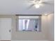 Cozy living room featuring neutral walls, a ceiling fan, and a large window that provides natural light at 1012 Pearce Dr # 105, Clearwater, FL 33764