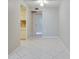 Bright living room with tile floors and a view into the kitchen, creating an open and inviting space at 1012 Pearce Dr # 105, Clearwater, FL 33764