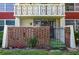 Private patio with gate and brick accents surrounded by lush landscaping at 1012 Pearce Dr # 105, Clearwater, FL 33764