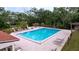 Large swimming pool surrounded by lounge chairs and a well-maintained pool deck at 1012 Pearce Dr # 105, Clearwater, FL 33764