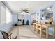 Bright dining area featuring large windows and easy access to the kitchen at 10900 Oakdale Ave, Port Richey, FL 34668