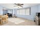 Sunny dining area with tile flooring, large window, and views of a nearby office area at 10900 Oakdale Ave, Port Richey, FL 34668