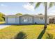 Charming single-story home with a well-maintained lawn and an attached garage at 10900 Oakdale Ave, Port Richey, FL 34668