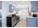 Efficient kitchen layout with sleek appliances, ample cabinet space, and stylish fixtures at 10900 Oakdale Ave, Port Richey, FL 34668
