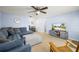 Comfortable living room with tile floors, plenty of seating, and modern media center at 10900 Oakdale Ave, Port Richey, FL 34668