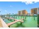 View of the dock with stunning water views near multi-story building at 11440 1St E St # 10, Treasure Island, FL 33706