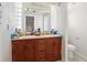 Bathroom boasts double sinks, a large mirror, and a separate toilet area at 1407 Overlea St, Clearwater, FL 33755