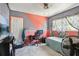 Bedroom featuring a desk, window with curtains, and unique painted wall design at 1407 Overlea St, Clearwater, FL 33755