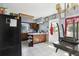 Kitchen boasts wooden cabinets, center island, and ample counter space at 1407 Overlea St, Clearwater, FL 33755