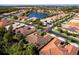 A lovely single-Gathering home in a beautiful neighborhood featuring lush landscaping and a serene lake view at 16106 Amethyst Key Dr, Wimauma, FL 33598