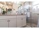 Bright bathroom with double vanity, modern fixtures, and a glass enclosed shower at 16106 Amethyst Key Dr, Wimauma, FL 33598