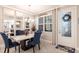 Elegant dining room featuring stylish decor and modern lighting fixtures at 16106 Amethyst Key Dr, Wimauma, FL 33598