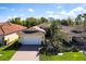 Charming single-story home featuring a well-manicured lawn and attached two-car garage at 16106 Amethyst Key Dr, Wimauma, FL 33598