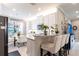 Open kitchen featuring modern appliances, a breakfast bar, and seamless flow to dining area at 16106 Amethyst Key Dr, Wimauma, FL 33598