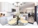 Bright kitchen with a casual dining table and views of the dining room at 16106 Amethyst Key Dr, Wimauma, FL 33598