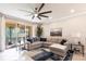 Spacious living room with comfortable seating and serene views of the outdoor patio at 16106 Amethyst Key Dr, Wimauma, FL 33598