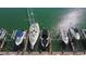 Aerial view showcasing multiple boats docked at the boat marina with clear, emerald water at 1621 Gulf Blvd # 308, Clearwater Beach, FL 33767