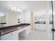 Spacious bathroom boasts granite countertops, ample storage, and bright, modern lighting at 1621 Gulf Blvd # 308, Clearwater Beach, FL 33767