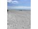 Expansive white sand beach, turquoise water, and blue skies create a relaxing coastal getaway at 1621 Gulf Blvd # 308, Clearwater Beach, FL 33767