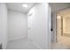 Hallway leading to bathroom with tub and shower at 1621 Gulf Blvd # 308, Clearwater Beach, FL 33767