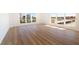 Bright living room with expansive windows and natural light shining on beautiful new wood floors at 1621 Gulf Blvd # 308, Clearwater Beach, FL 33767