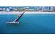 Pier 60: An aerial view of a pier extending out over the water and beach at 1621 Gulf Blvd # 308, Clearwater Beach, FL 33767