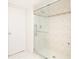Large glass shower with glass door and tiled wall at 1621 Gulf Blvd # 308, Clearwater Beach, FL 33767