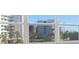 Views of city buildings with palm trees from beautiful windows at 1621 Gulf Blvd # 308, Clearwater Beach, FL 33767