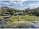 Aerial view of a home and buildings with a dock on a large lot of land at 18253 Townsend House Rd, Dade City, FL 33523