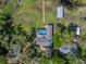 Aerial top down perspective shows swimming pool, boat dock and sheds at 18253 Townsend House Rd, Dade City, FL 33523