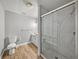 Neat bathroom with a glass-enclosed shower and a classic white vanity at 18253 Townsend House Rd, Dade City, FL 33523
